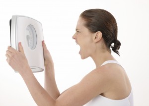 woman holding scale