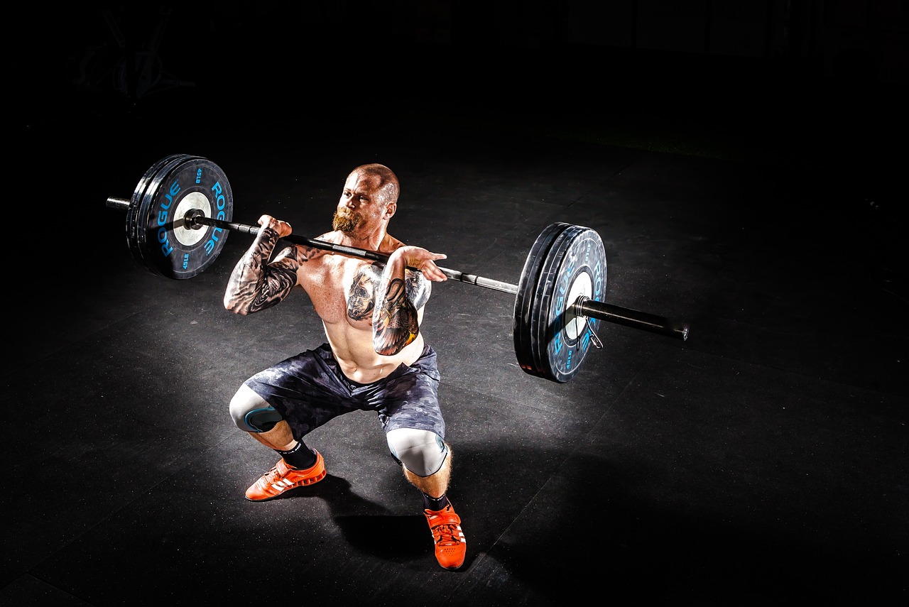 man lifting weights